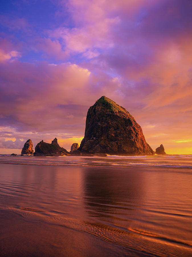 Sunset at Haystack Rock Photograph by Kevin Schwalbe