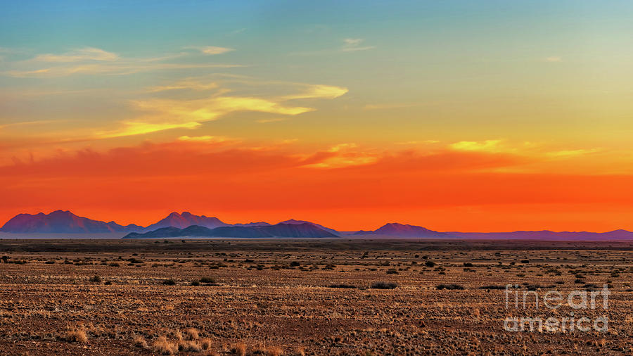 Sunset  at Namib desert from Sossus Dune Lodges in Namibia. Photograph by Marek Poplawski