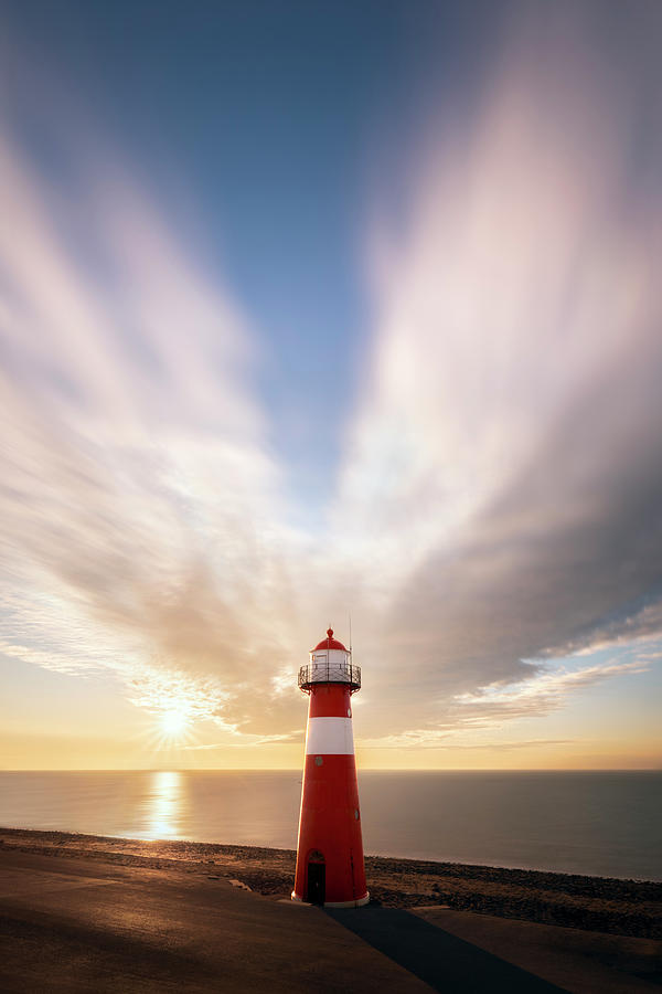 Sunset at the lighthouse Photograph by Patrick Van Os