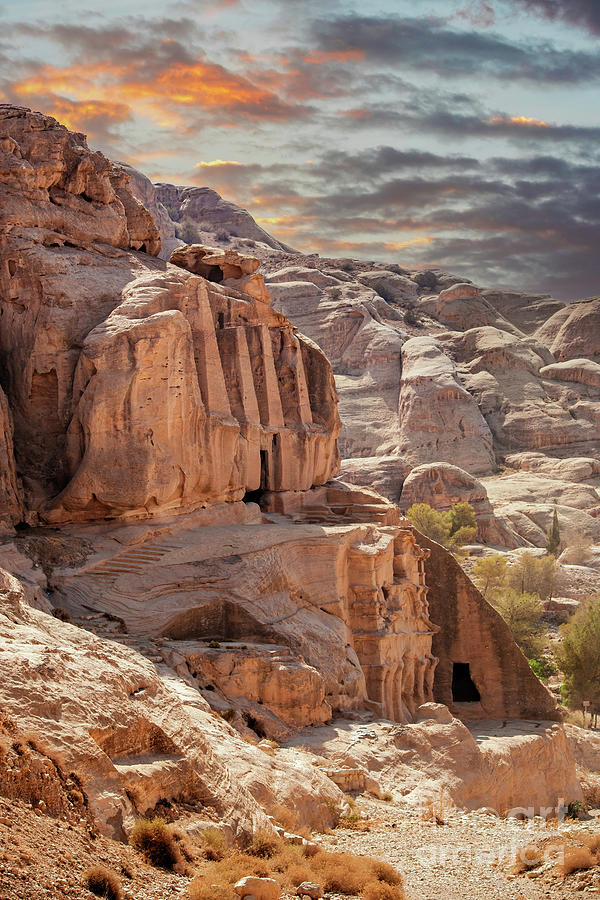Sunset at the lost city of Petra, Jordan. Amazing buildings are carved out of the pink rock and the Rose City dates to around 300 BC Photograph by Jane Rix