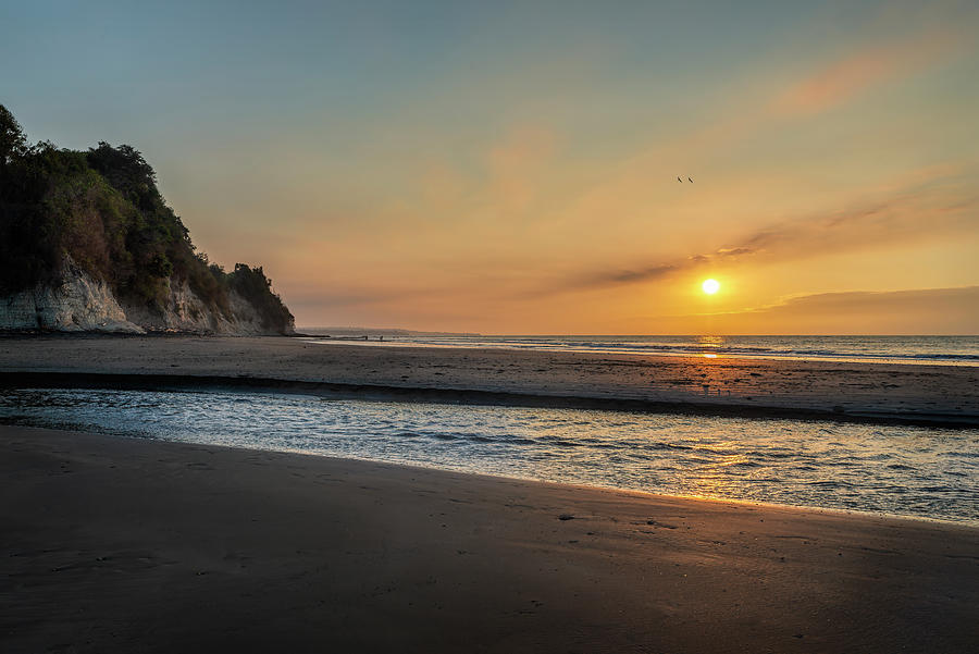 Sunset at Tonchigue beach Photograph by Henri Leduc