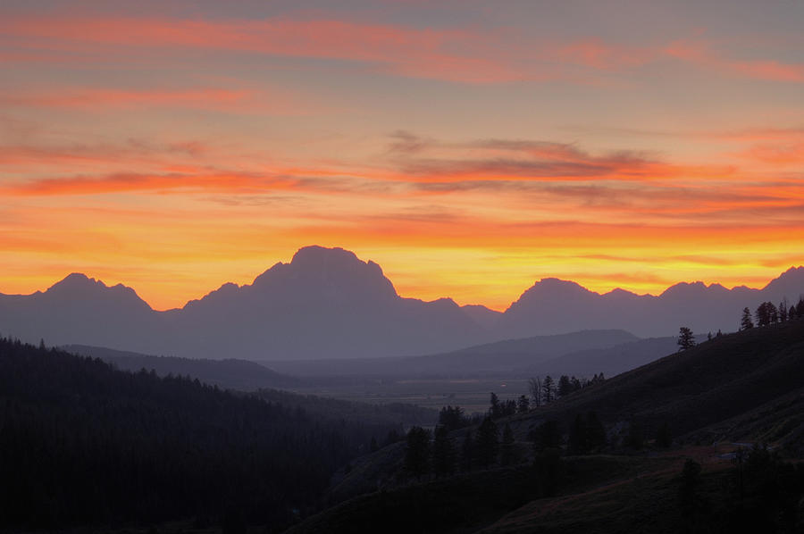 Sunset behind the Grand Tetons in Wyoming. Photograph by Rob Huntley