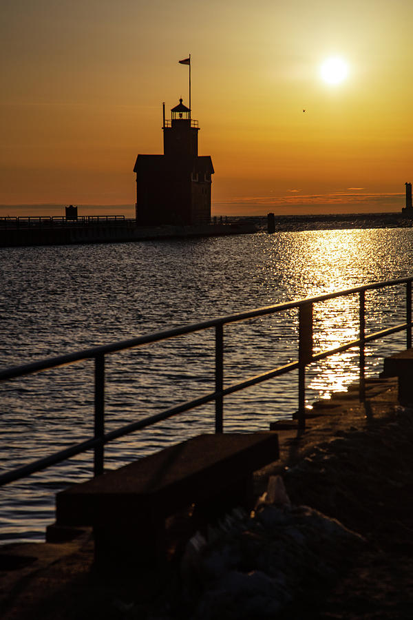 Sunset in winter of the Holland Michigan Lighthouse along Lake Michigan Photograph by Eldon McGraw