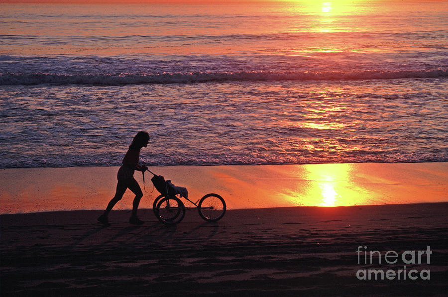 Sunset Jog With A  Baby Stroller, Venice, California, .  Photograph by Tom Wurl