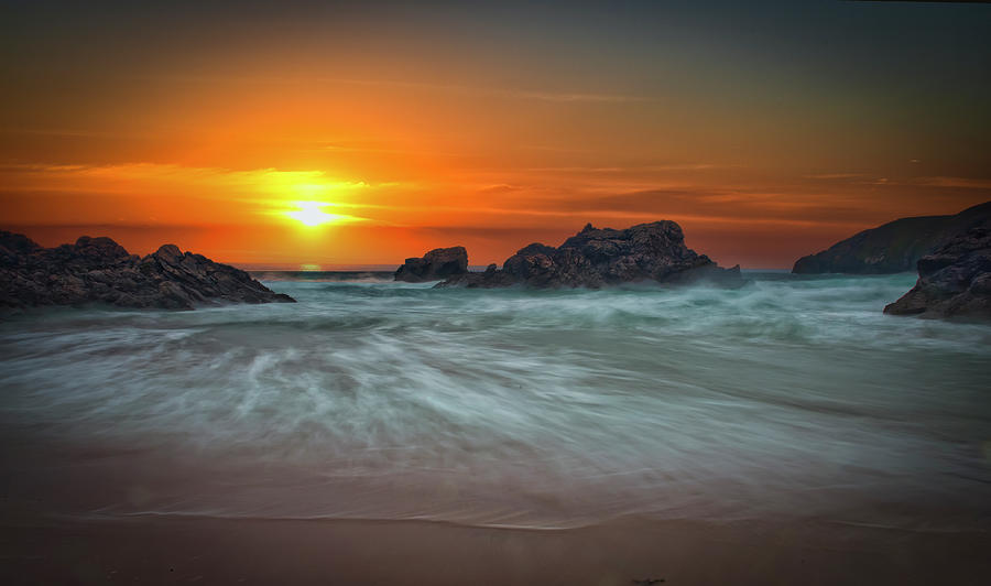 Sunset on a rocky beach Photograph by Remigiusz MARCZAK