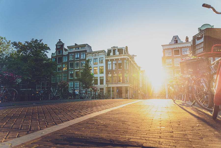 Sunset on a street in Amsterdam Photograph by George Pachantouris