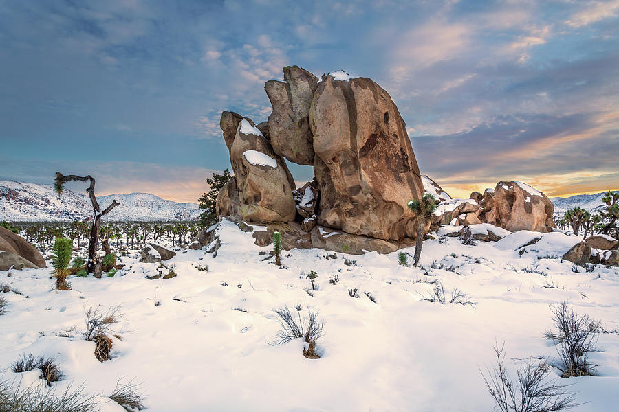 Sunset on Snow Covered Rocks Photograph by Rick Strobaugh
