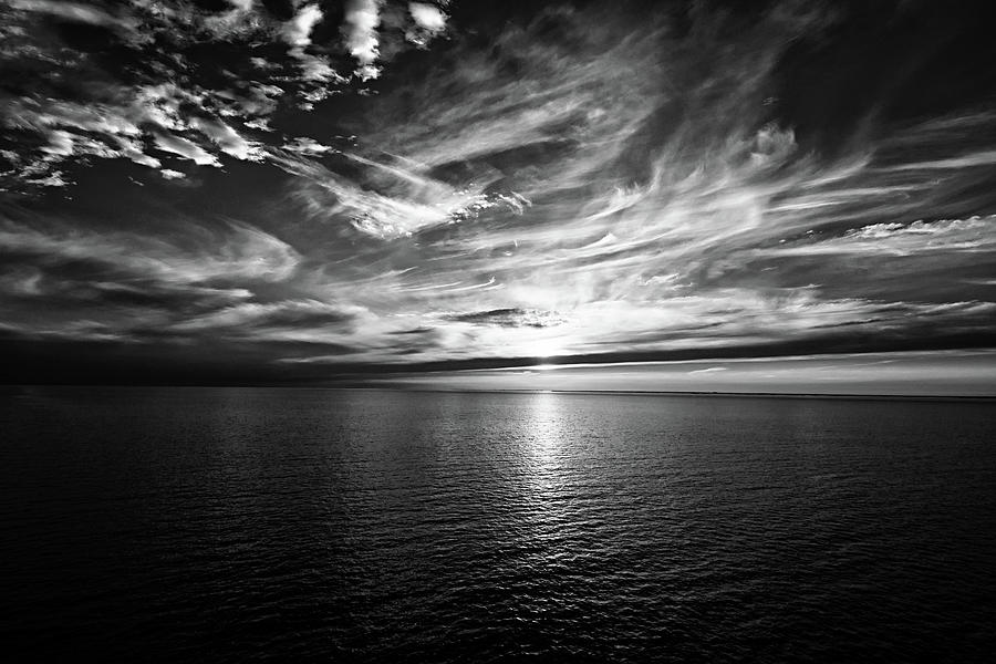 Sunset on the horizon at sea Photograph by Bernhard Schaffer