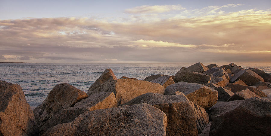 Sunset On The Rocks at Atlantic Beach North Carolina Photograph by Bob Decker