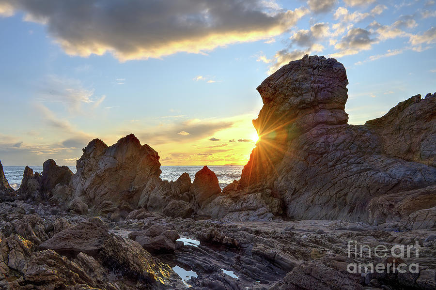 Sunset On The Rocks Photograph by Eddie Yerkish