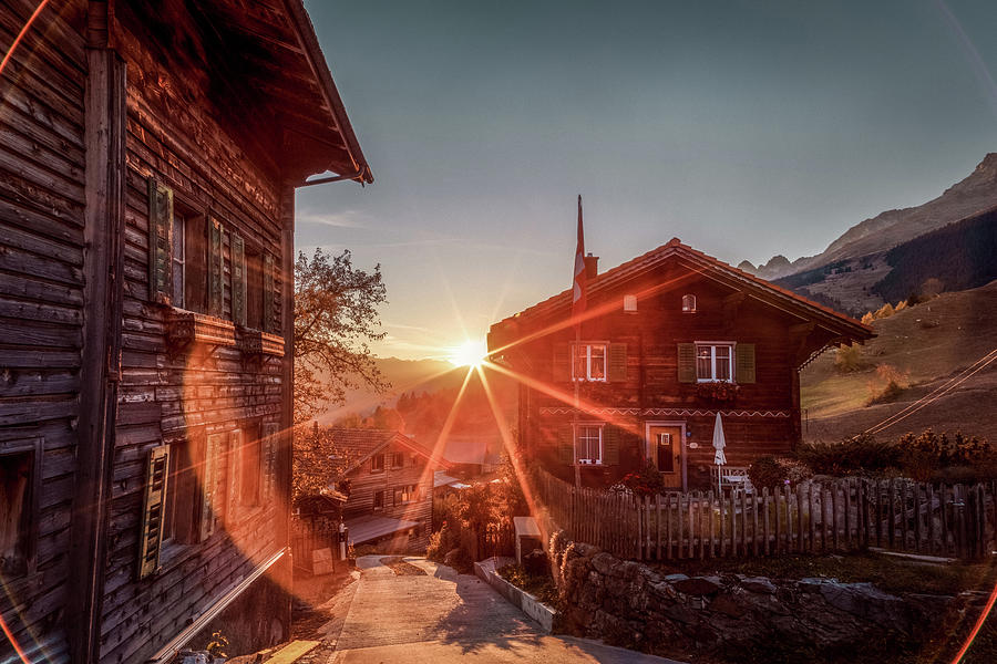 Sunset on the small mountain village Photograph by Benoit Bruchez