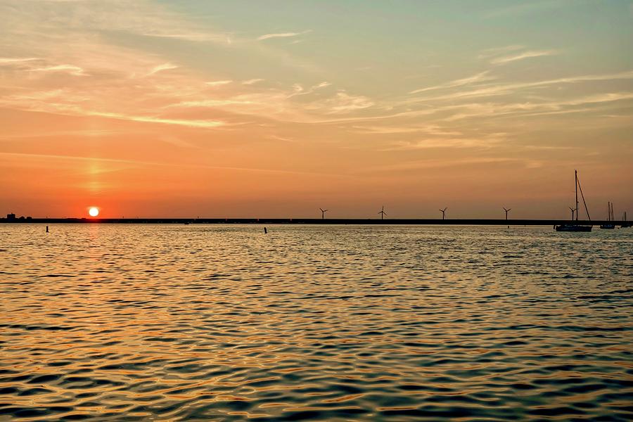 Sunset On The Water Photograph by Marjolein Van Middelkoop