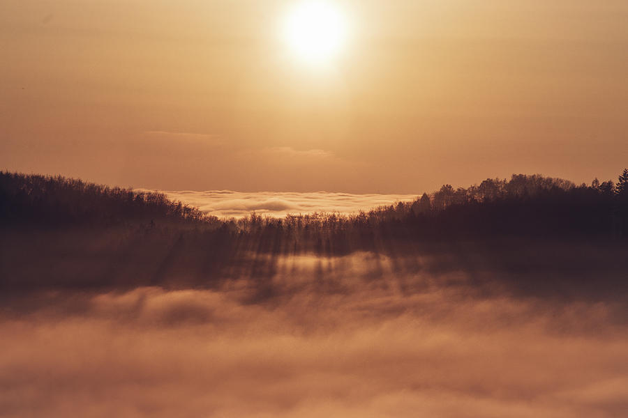 Sunset over a sea of clouds Photograph by Vaclav Sonnek
