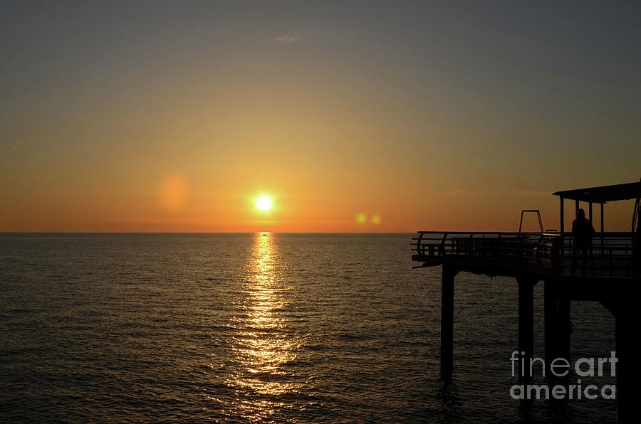 Sunset over Black Sea horizon at pier Batumi Georgia Photograph by Imran Ahmed