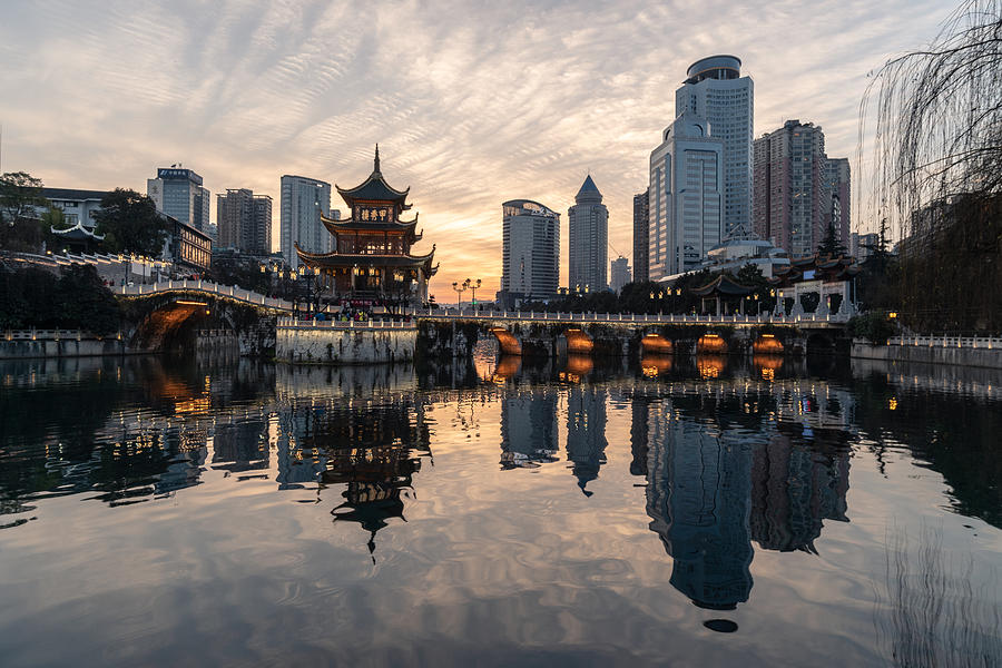 Sunset over Guiyang downtown district in Guizhou province, China Photograph by @ Didier Marti