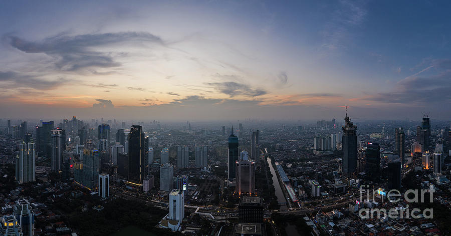 Sunset over Jakarta skyline business district in Indonesia Photograph by Didier Marti