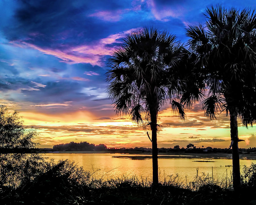 Sunset over Lake Sumter Photograph by Betty Eich