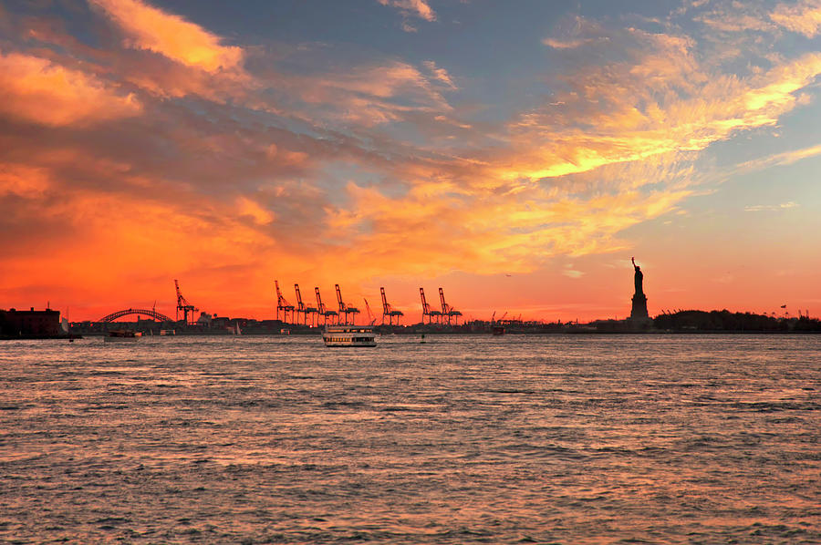 New York City Photograph - Sunset Over Liberty by Joann Vitali