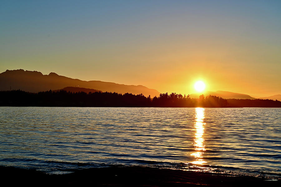 Sunset over Madrona Point from Beachcomber upon Nanoose. Photograph by Brian Sereda