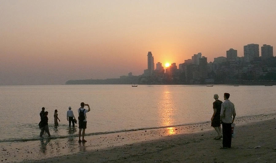 Sunset over Malabar hill from Chowpatty beach in Mumbai, Maharashtra, India Photograph by Photo by Victor Ovies Arenas