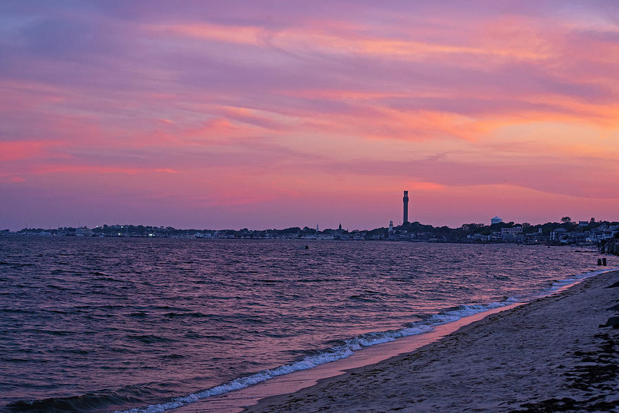 Sunset over Provincetown MA Pilgrim Monument from Bayside Beach Photograph by Toby McGuire