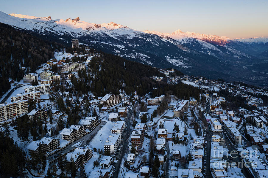 Sunset over the Crans Montana village in the alps in Valais, Swi ...