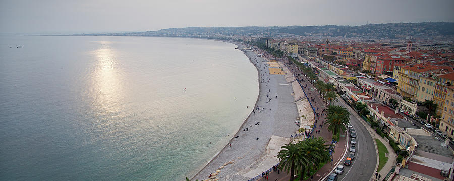  Sunset over the French Riviera in Nice on a misty evening Photograph by Jean-Luc Farges