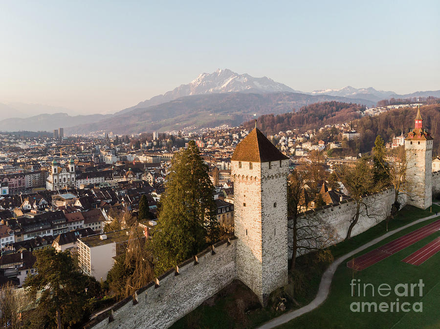 Sunset over the Lucerne old town medieval fortification in Switz Photograph by Didier Marti