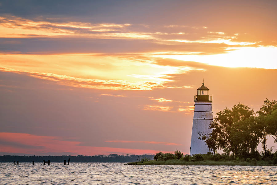 Sunset Over the Madisonville Lighthouse Photograph by Andy Crawford