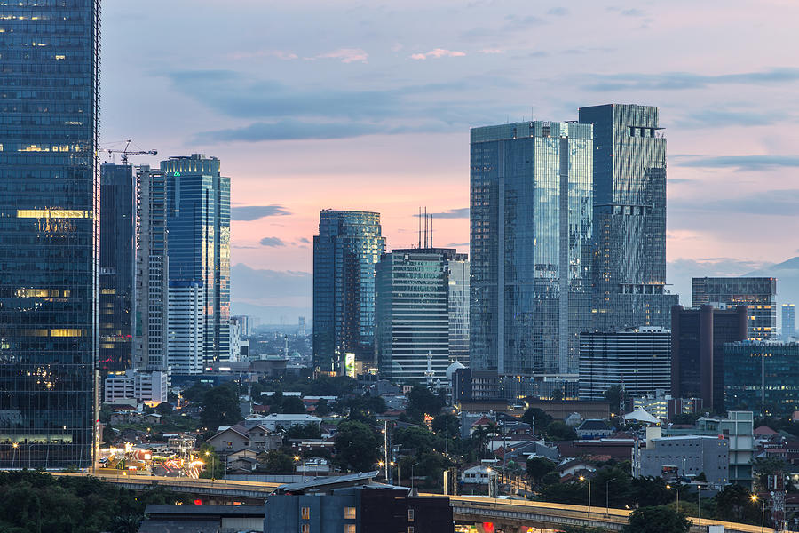 Sunset over the skyscrapers of the Jakarta business district in Indonesia capital city Photograph by @ Didier Marti