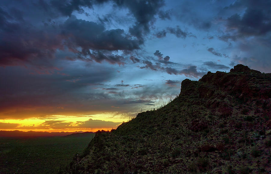 Sunset Over Tucson Mountains with Vibrant Clouds and Cacti Silhouettes Photograph by Chris Anson