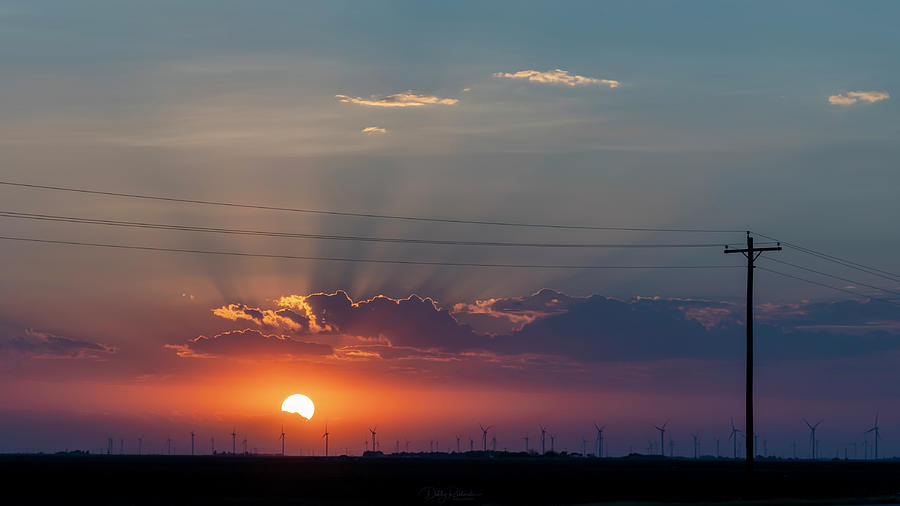 Sunset over wind turbines Photograph by Debby Richards