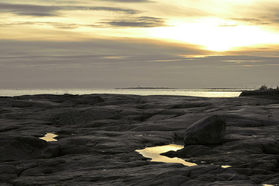 Sunset reflections in puddles at a rocky shore Photograph by Ulrich Kunst And Bettina Scheidulin