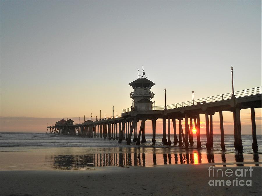 Sunset Through The Huntington Beach Pier Photograph by Fantasy Seasons
