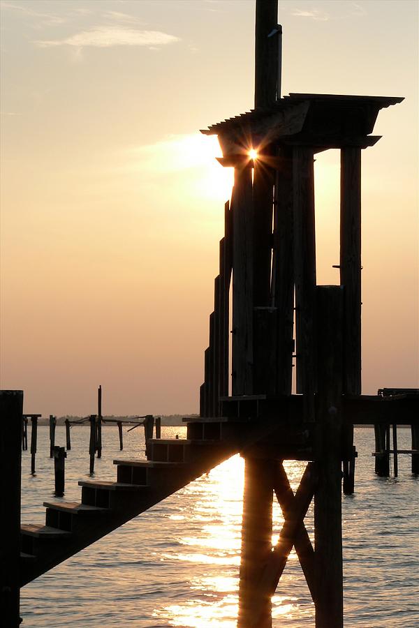 Sunset Through The Pier Gate Photograph by Kathy K McClellan