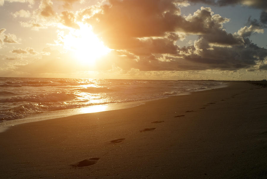 Sunset view and footprints in sand Photograph by Mihaela Muntean