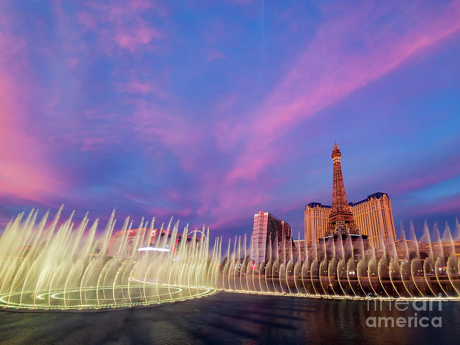 Las Vegas Photograph - Sunset view of the Paris Casino with Eiffel tower and water danc by Chon Kit Leong