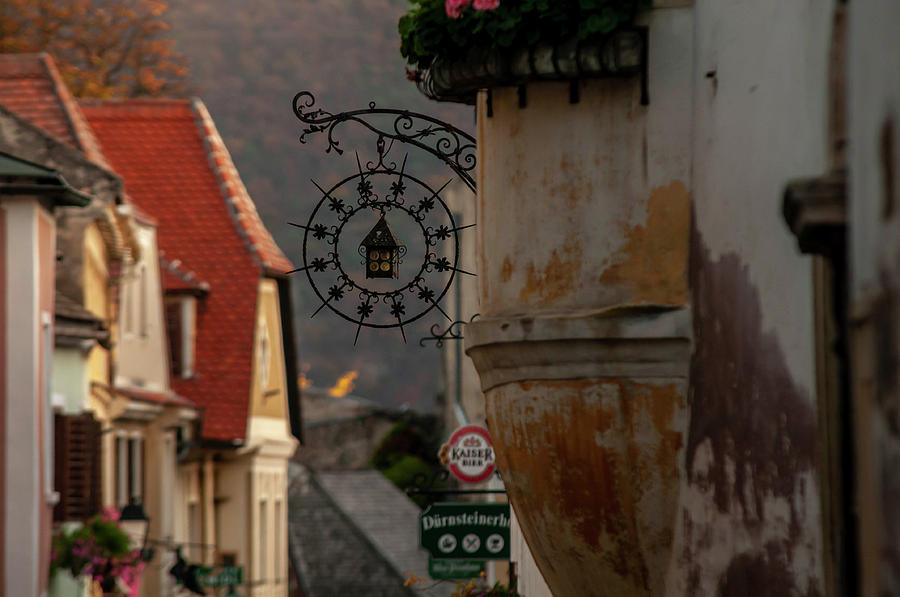 Sunset Walks In Durnstein. Main Street And Forged Signs 3 Photograph by Jenny Rainbow