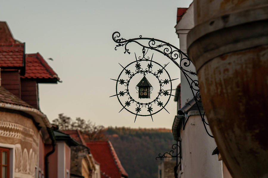 Sunset Walks In Durnstein. Main Street And Forged Signs 4 Photograph by Jenny Rainbow