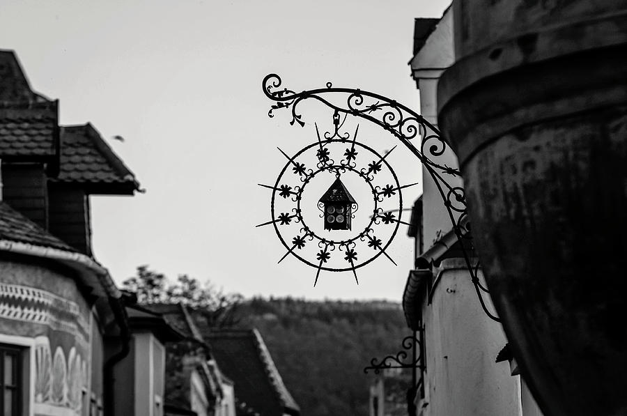 Sunset Walks In Durnstein. Main Street And Forged Signs 4 Monochrome Photograph by Jenny Rainbow
