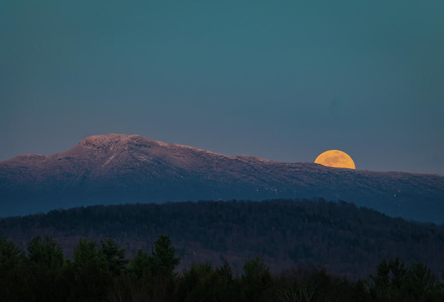 super moon rising over Mount Mansfield in the Green Mountains of Vermont Photograph by Ann Moore