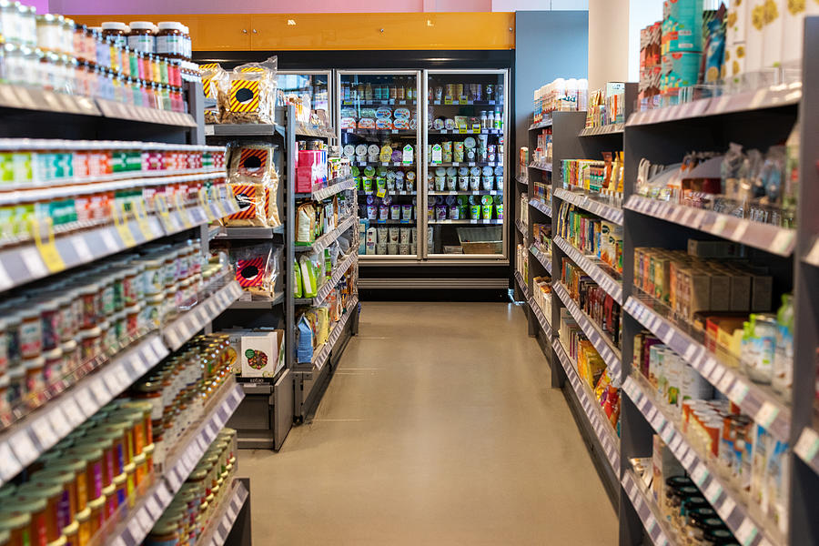 Supermarket aisles with variety of products Photograph by Luis Alvarez