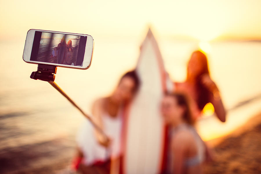 Surfer girls making a selfie Photograph by AleksandarNakic