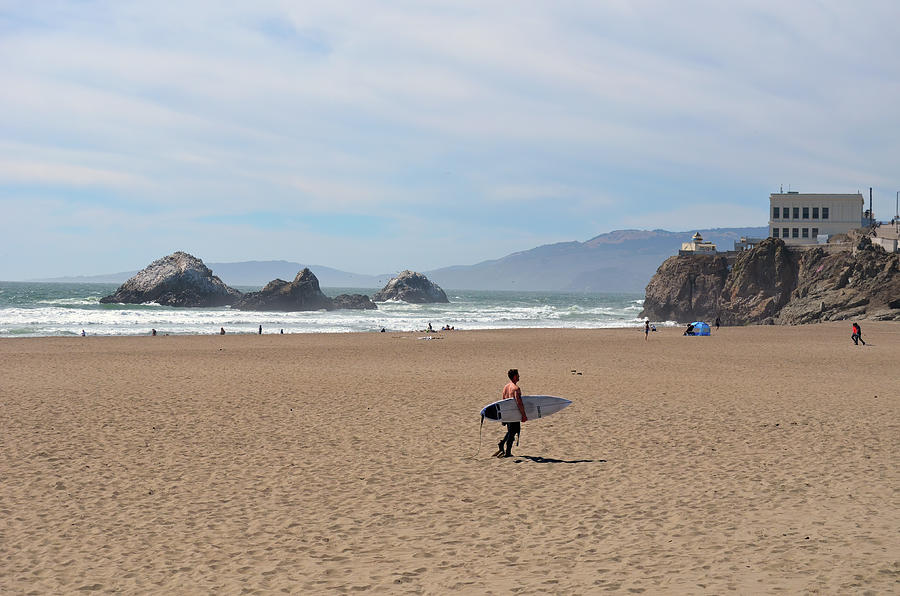 Surfer on Ocean Beach out to Seal Rocks and Camera Obscura San Francisco Photograph by Shawn OBrien