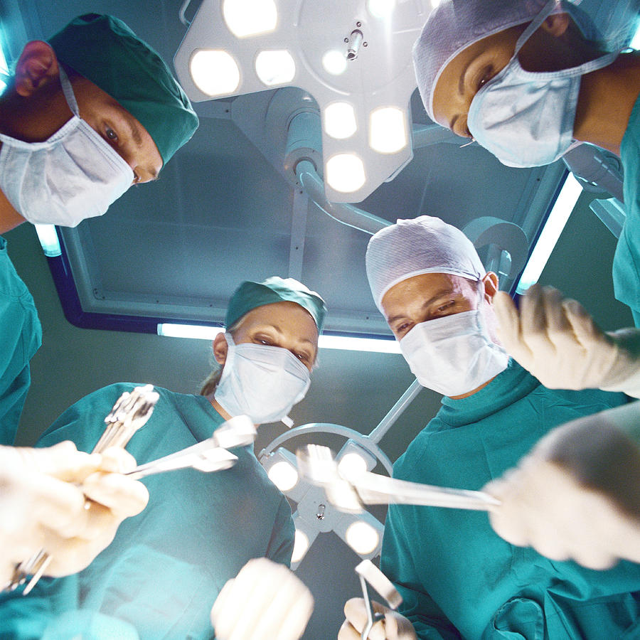 Surgical team preparing to operate, low angle view Photograph by Vincent Hazat