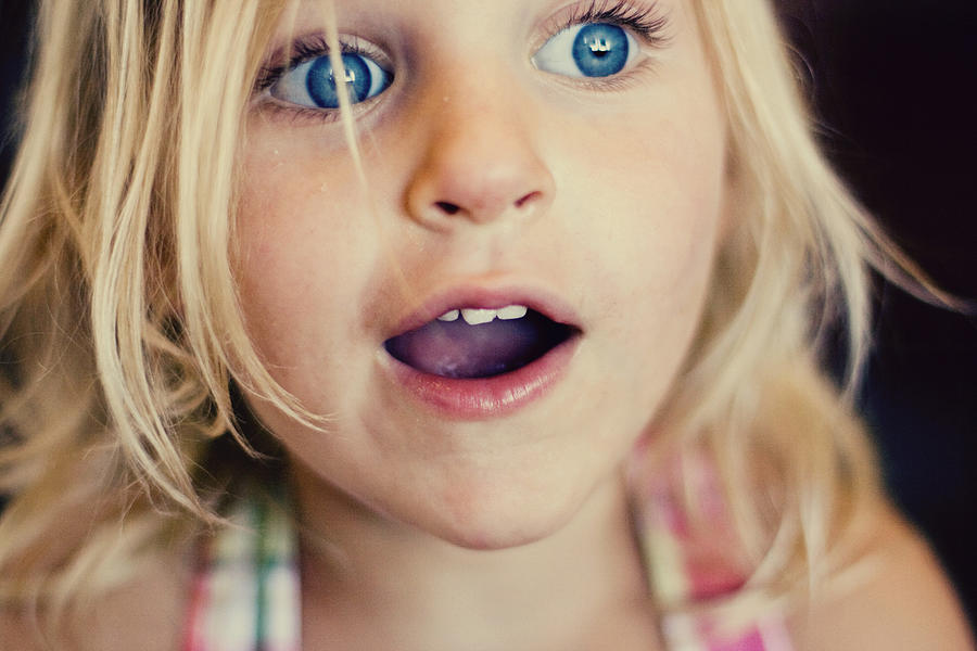 Surprised girl Photograph by Laura Yurs