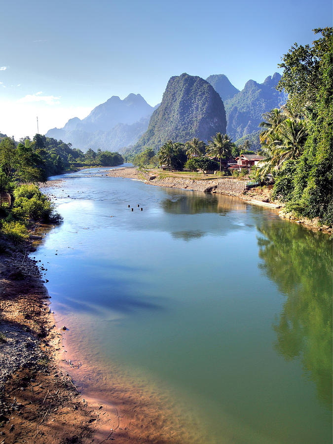 Surreal landscape by the Song river at Vang Vieng Photograph by Chantal
