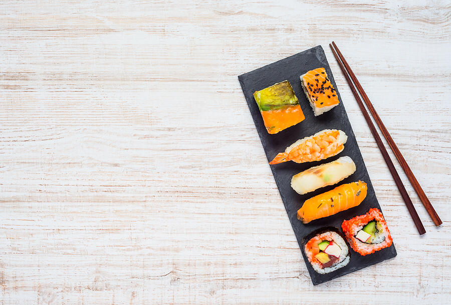 Sushi on Plate with Chopsticks and Copy Space Area Photograph by Xfotostudio