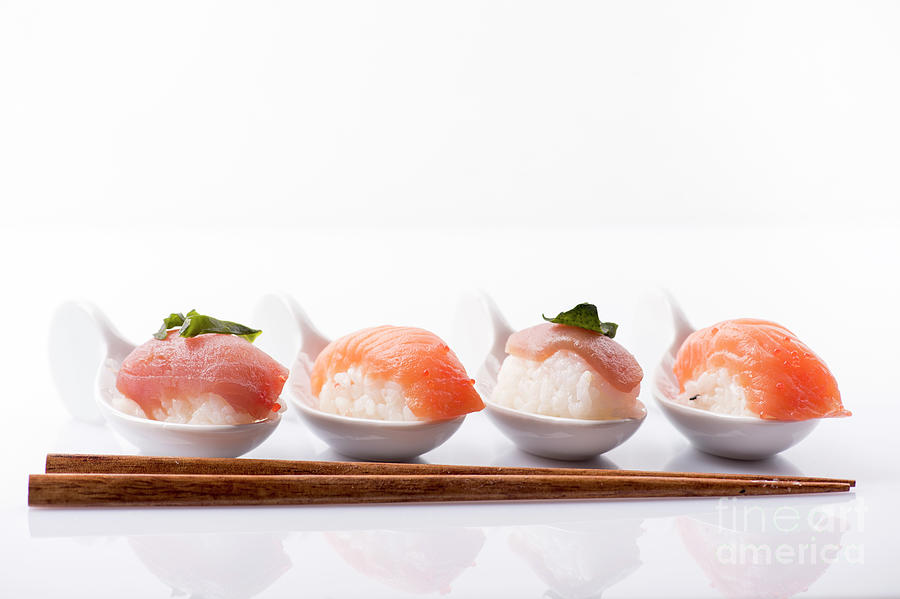 Sushi Set With Wooden Sticks On White Photograph