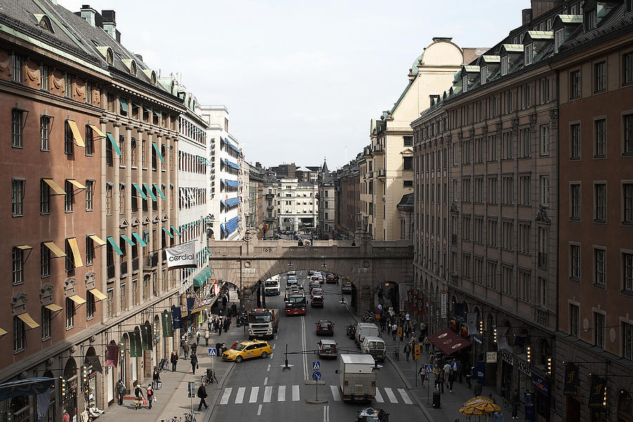 Sweden, Stockholm, Traffic on street with buildings Photograph by Matt Henry Gunther